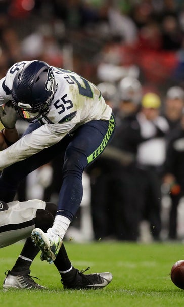 Under pressure: Sacks rise for Carr behind hurt Raiders line